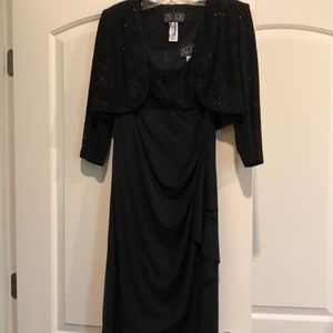 Beautiful cocktail dress. Sleeveless with jacket. Only worn once.